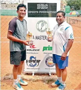  ??  ?? D. Manish and Mohammed Waheed pose with their trophies after winning the TSTA Master Series tennis tournament for veterans St Thomas High School tennis courts in Vinayak Nagar, Neredmet, Hyderabad.