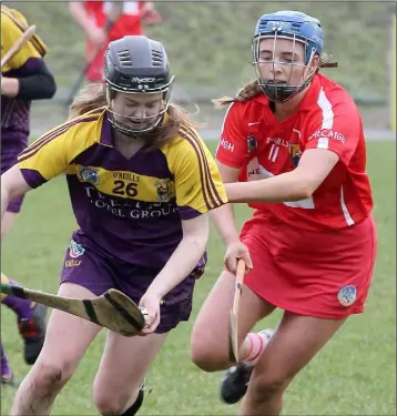  ??  ?? Chloe Foxe of Wexford taking on Cork’s Orla Cronin.