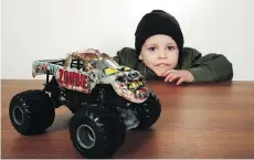  ??  ?? Francis Morgan-Buckmire, almost four, admires Zombie, his favourite monster truck, in anticipati­on of this weekend’s Monster Jam show. The youngster is giving away tickets to the high-octane event.