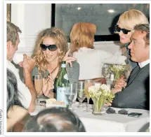  ?? ?? Sarah Jessica Parker socializes as Ellen Barkin leans in.