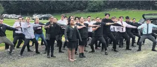  ?? PHOTO: JOSHUA WALTON ?? Pupils’ tribute . . . Wakatipu High School pupils and friends performing the haka to remember the school’s head of drama, Kate Moetaua, at her funeral, near Arrowtown, yesterday.