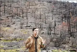  ?? Brian van der Brug Los Angeles Times ?? ELLIOTT VANDER KOLK, regional forester for the Sierra Nevada Conservanc­y, near a Greenville hillside that has burned twice in the last 15 years.