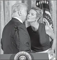  ?? The New York Times/ DOUG MILLS ?? President Donald Trump
exchanges a kiss Tuesday with his daughter Ivanka during an event with small- business leaders in the East Room of the White House.