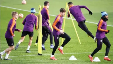  ??  ?? Manchester City’s midfielder Oleksandr Zinchenko (left), defender John Stones (centre) and midfielder Raheem Sterling attend a team training session at City Football Academy in Manchester, north west England on the eve of their Champions League round of 16, second leg football match against FC Schalke. — AFP photo