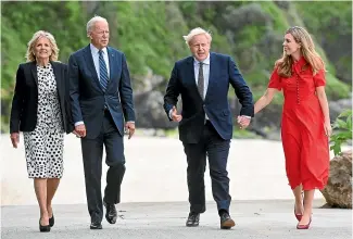  ?? AP ?? Britain’s Prime Minister Boris Johnson, his wife Carrie Johnson and US President Joe Biden with Dr Jill Biden walk outside Carbis Bay Hotel, Cornwall, Britain, ahead of the G7 summit.