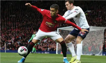  ?? Photograph: Matthew Peters/Manchester United via Getty Images ?? Andreas Pereira, the Belgium-born Brazil internatio­nal who joined United when he was 16, tries to escape the clutches of Andy Robertson of Liverpool.