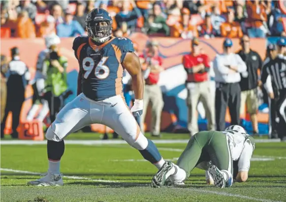  ?? John Leyba, The Denver Post ?? Broncos defensive end Shelby Harris celebrates after sacking Jets quarterbac­k Josh McCown during the first quarter of Sunday’s game in Denver.