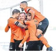  ??  ?? United’s Craig Curran (centre) celebrates his goal