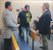  ?? ROSIE MULLALEY/THE TELEGRAM ?? Convicted rapist Sofyan Boalag speaks to his lawyer, Jeff Brace (right), before being led out of the courtroom in provincial court in St. John’s Friday morning. At left is the interprete­r.