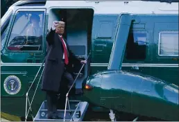  ?? ALEX BRANDON — THE ASSOCIATED PRESS ?? President Donald Trump gestures as He boards Marine One on tHe SoutH Lawn of tHe WHite House in WasHington on Wednesday. Trump is en route to His Mar-a-Lago Florida Resort.