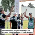  ??  ?? Finishers being congratula­ted by Race Director Denis Crassier and Yasas Hewage