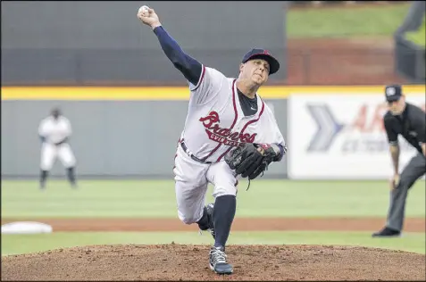  ?? KARL L. MOORE / GWINNETT BRAVES ?? Kris Medlen delivers a pitch in his Gwinnett Braves 2017 debut Friday at Coolray Field. The former Atlanta starter pitched 5⅔ innings while working to recover from injuries and return to the majors.