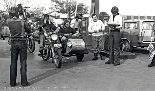  ??  ?? Rob Atlee checks in Chris Davy and Wayne Keeping (in chair) on their CB750 Honda.