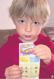  ??  ?? Monty with the Spanish Shopkins packaging.