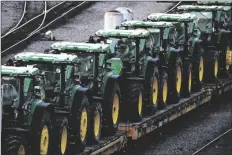  ?? GENE J. PUSKAR/AP sit in Norfolk ?? A CONSIST OF JOHN DEERE TRACTORS
Southern’s Conway Yard in Conway, Pa., on Dec. 5, 2022. On Thursday, the Labor Department releases the producer price index for January, which jumped 0.7%, driven up in part by a 5% surge in energy prices.