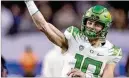  ?? FILE PHOTOS ?? Quarterbac­k prospects in the upcoming draft include (from left) Michigan’s J.J. McCarthy, Washington’s Michael Penix Jr. and Oregon’s Bo Nix, formerly of Auburn. Could the Falcons snag any of the three?