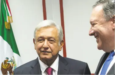  ?? Pedro Pardo / AFP / Getty Images ?? Secretary of State Mike Pompeo (right) meets with President-elect Andres Manuel Lopez Obrador.