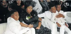  ?? Pictures: ROGAN WARD ?? MOURNING: From the left, S’fiso Ncwane’s son Ngcweti and his widow, Ayanda, with family at the memorial service in Durban this week