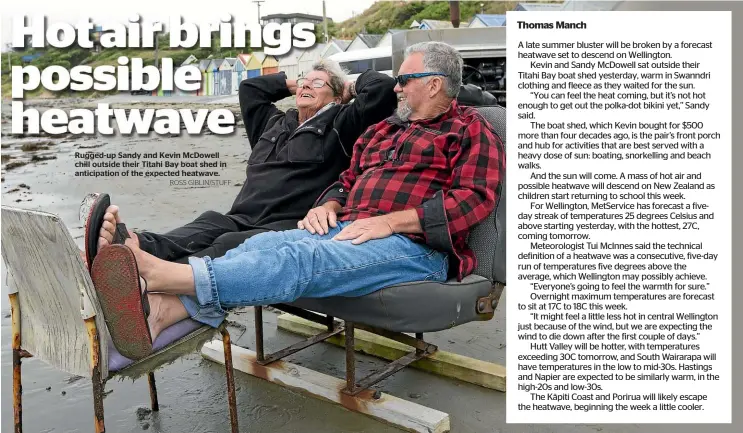  ?? ROSS GIBLIN/STUFF ?? Rugged-up Sandy and Kevin McDowell chill outside their Titahi Bay boat shed in anticipati­on of the expected heatwave.