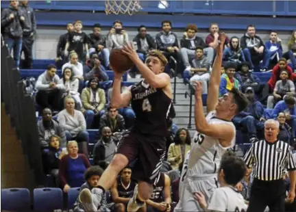  ?? DAVID M. JOHNSON - DJOHNSON@DIGITALFIR­STMEDIA.COM ?? Lansingbur­gh’s Vinny Tario goes up for a layup during a Colonial Council boys basketball game against Cohoes Dec. 1, 2017at Cohoes High School.