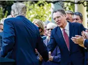  ?? PETE MAROVICH / ABACA PRESS ?? President Donald J. Trump greets U.S. Trade Representa­tive Robert Lighthizer after an October speech by Trump at the White House.