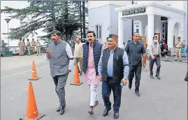  ?? DEEPAK SANSTA/HT ?? Leader of opposition in Himachal assembly Mukesh Agnihotri, along with Congress MLAs Vikramadit­ya Singh and Vinay Kumar, outside the Vidhan Sabha on the first day of its monsoon session, in Shimla on Wednesday.