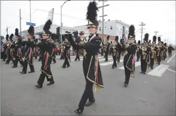  ?? ?? The San Pedro High School Golden Pirate Regiment marches in the 2018 Spirit of San Pedro Holiday Parade. File photo