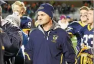  ?? DAVID TURBEN — THE NEWS-HERALD ?? Kirtland football coach Tiger LaVerde smiles after the Hornets defeated Nelsonvill­e-York, 44-0, in the Division VI state semifinal.