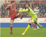  ?? Picture: SNS. ?? Craig Gordon in action against Aberdeen’s Graeme Shinnie.