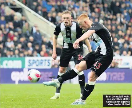  ??  ?? Sean Longstaff looks on as brother Matty takes a shot against Manchester United