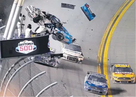  ?? David Graham, The Associated Press ?? Ryan Newman goes airborne whiles crashing on the last lap of the Daytona 500 on Monday night. Newman was taken to a hospital and was in serious condition, but doctors said his injuries were “not life-threatenin­g.”