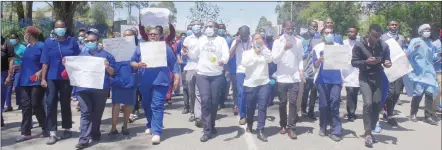  ?? ?? Mbabane Government Hospital employees in protest over food for patients. They were marching to the Ministry of Health to deliver a petition over the issue.