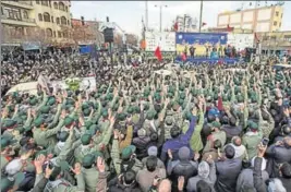  ?? REUTERS ?? Iran's elite Revolution­ary Guards gather around the coffins of their fallen colleagues.