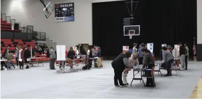  ?? The Sentinel-Record/Lance Porter ?? Students at Cutter Morning Star High School learn about budgeting as they visit different tables at the 2023 Financial Reality Fair on March 9 in Eagle Arena.