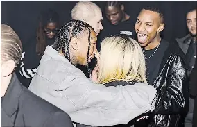  ?? (Getty Images) ?? Avril and Tyga looked completely smitten as they kissed in front of the cameras.