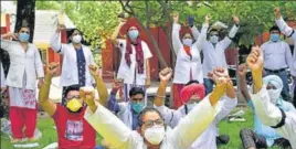  ??  ?? Members of the Punjab Rural Health Pharmacy Officers Associatio­n raising slogans outside the deputy commission­er’s office in Amritsar on Friday.