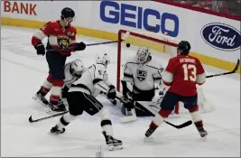  ?? MARTA LAVANDIER — THE ASSOCIATED PRESS ?? Florida’s Sam Reinhart (13) scores the winning goal in overtime to beat the Kings on Thursday night. The victory pushed the Panthers’ winning streak to nine games.