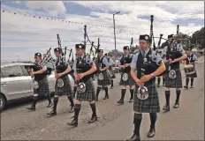  ?? 01_B33games02 ?? Scottish Champions, Kintyre Schools Pipe Band, make their way along the promenade.