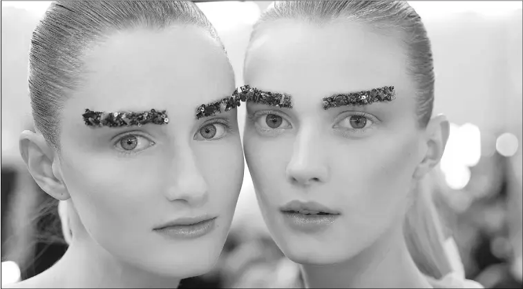  ?? Supplied ?? Chanel makeup creative director Peter Philips presented crystal-encrusted embroidere­d brows for fall/winter 2012. Full eyebrows — but not unkempt or ungroomed — top the style list for 2013.