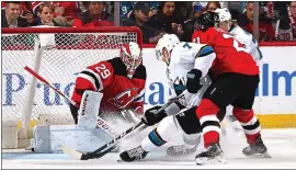  ?? BRUCE BENNETT — GETTY IMAGES ?? Devils goalie Mackenzie Blackwood makes a close-in save on a shot by the Sharks’ Dylan Gambrell during Thursday’s 2-1 loss at Prudential Center in Newark, New Jersey.
