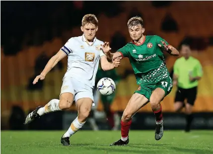  ?? ?? THICK OF THE ACTION: Port Vale’s Nathan Smith battles for the ball against Walsall.