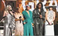  ?? Matt Sayles / Associated Press ?? Lady Gaga, from left, Jada Pinkett Smith, Alicia Keys, Michelle Obama and Jennifer Lopez speak at the 61st annual Grammy Awards on Sunday in Los Angeles.