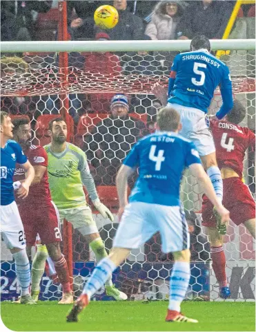  ??  ?? St Johnstone’s Joe Shaughness­y rises highest to head the visitors ahead in the 70th minute