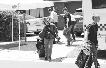  ??  ?? Victorian police conduct a search of a house in Werribee in the Western suburbs of Melbourne in relation to the arrest of a man suspected of plotting an attack on New Year’s Eve. — Reuters photo