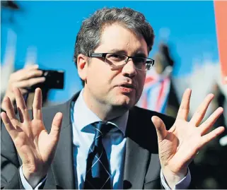  ??  ?? Eliot Higgins, founder of online investigat­ion group Bellingcat, speaks to the media on College Green in London on Tuesday after making a presentati­on in parliament on their investigat­ion into the suspects of the Sergei Skripal poisoning. AFP