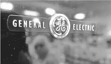  ?? — AFP photo ?? General Electric announced it will sell its Biopharma unit to Danaher for US$21.4 billion in cash as it reduces debt amid an ongoing corporate turnaround effort. The transactio­n allows the company to slim down further, and covers instrument­s and software that support research and developmen­t of biopharmac­eutical drugs, a business that comprises about 15 per cent of the revenues of GE’s health sector.