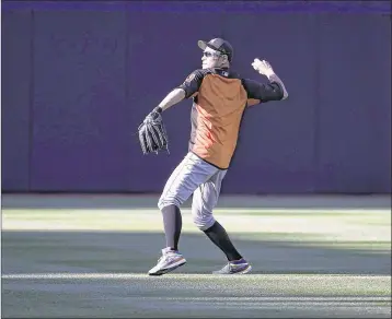  ?? DENIS POROY / GETTY IMAGES ?? Marlins outfielder Ichiro Suzuki catches some sun while warming up before Friday’s game against the San Diego Padres at Petco Park. For the result and highlights, go to