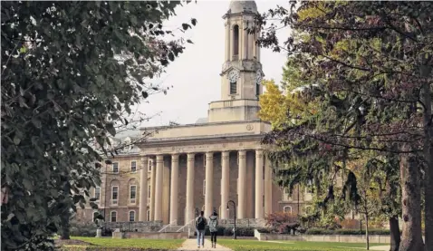  ?? Gene J. Puskar / Associated Press ?? People walk on the Penn State University main campus in State College, Pa., from 2017. Your college major could make a big difference in lifetime earnings: The disparity between the lowest- and highest-paying majors is $3.4 million, according to a 2015 report by the Georgetown University Center on Education and the Workforce.