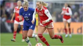  ?? AFP/VNA Photo ?? EURO AMBITIONS: Arsenal's Stina Blacksteni­us (right) gets away from Chelsea's Millie Bright during the recent Women's League Cup final at Selhurst Park in London.