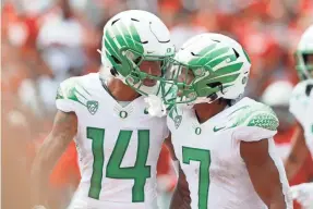  ?? JOSEPH MAIORANA/USA TODAY SPORTS ?? Oregon running back CJ Verdell (7) celebrates his touchdown run with wide receiver Kris Hutson against Ohio State.